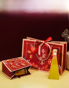 Red Chinese wedding gift bags in large and small sizes with golden handles and floral patterns