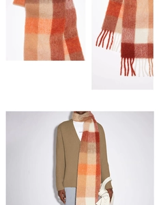 Détail de l'écharpe à carreaux orange et marron avec franges et texture mohair