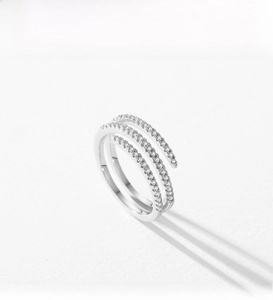 Macro shot of triple-layer S925 silver ring with pave-set white cubic zirconia stones