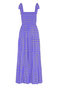 Detail of purple smocked bodice long dress with yellow square dots and tie straps