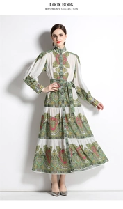 Detail of elegant paisley print maxi dress with lantern sleeves and a flared hemline