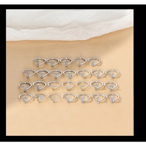 Macro display of S925 sterling silver initial rings featuring sparkling cubic zirconia