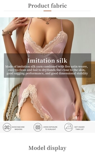 Detail view of pink imitation silk sleepwear featuring intricate beige lace and a side slit