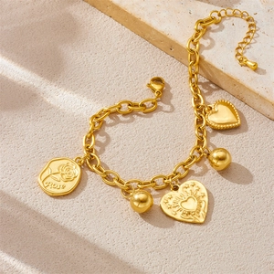 Gold stainless steel chain bracelet with rose coin and sun heart charms on stone
