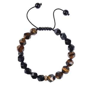 Detail of hand-woven bracelet with 10mm tiger eye stones and faceted black obsidian beads