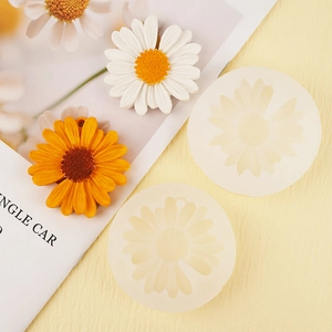 Detailed macro of translucent daisy silicone molds and completed floral resin crafts