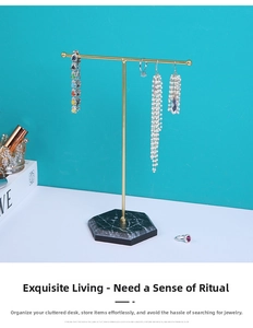Detail of T-bar metal jewelry stand with black hexagonal base for necklace and earrings