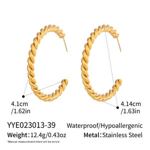Macro detail of twisted texture gold stainless steel C-shape earrings with size info