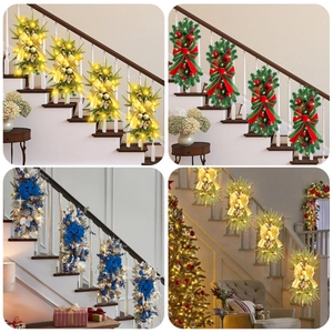 Christmas staircase swag with LED lights, festive bows, and ornaments in gold, red and blue