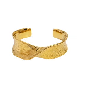 Minimalist 18K gold stainless steel open bangle featuring unique lava hammer texture