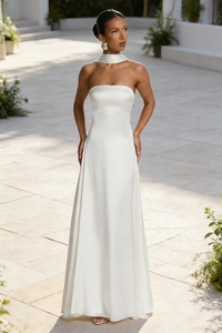 Detail of elegant pearl white satin formal dress with backless design and neck accessory