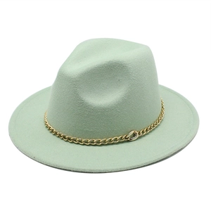 Detailed view of mint green wool felt fedora hat with decorative gold chain band
