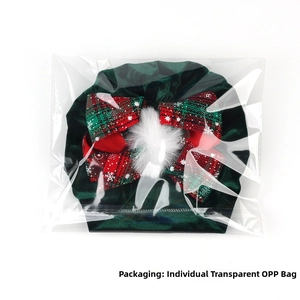Detail of Christmas velvet baby turban with bow in independent transparent OPP bag