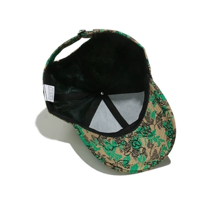 Detail view of baseball cap interior with black mesh lining and 100% polyester label