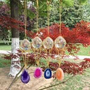 K9 crystal ball prisms with colorful agate slices hanging on a tree as suncatchers