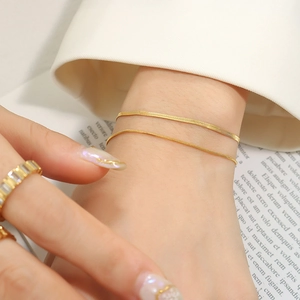 Minimalist double-layered gold snake chain bracelet in polished stainless steel for women
