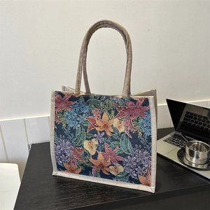Floral tapestry tote bag with cream rope handles and vintage jacquard pattern