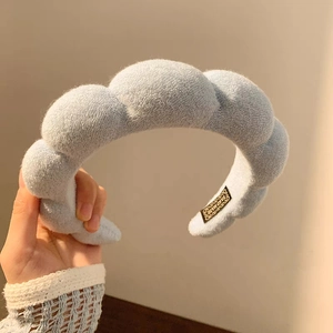 Light blue sponge padded headband in plush fabric with a soft puff design for women