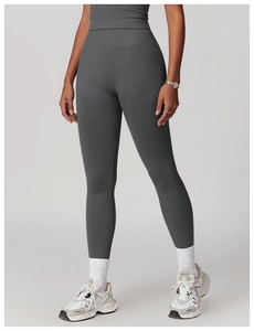 Detail view of high-waist seamless yoga pants with ribbed tummy control and laser-cut holes