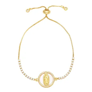 Detail of adjustable gold bolo bracelet with Virgin Mary pendant and zircon stones