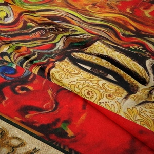 Detail of bohemian tapestry fabric showing intricate artistic print and woven texture