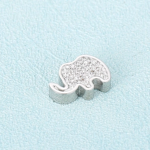 Polished silver elephant pendant necklace with sparkling crystal inlay on blue background