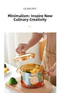 Amber glass cooking pot with wooden trivet showing healthy corn and broccoli inside