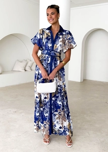 Detail of floral puff sleeve midi dress with front buttons and matching fabric belt