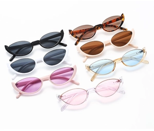 Detailed flat lay of cat-eye sunglasses in multiple colors like tortoiseshell and pink