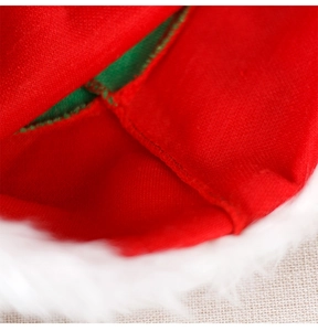 Detailed macro view of stitching on red and green striped fabric with white plush trim