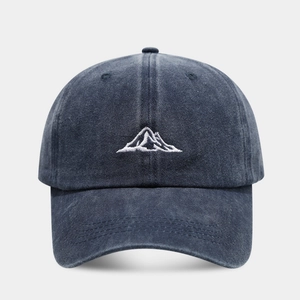 Faded navy cotton baseball cap with mountain embroidery and curved brim for outdoors