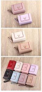 Detail view of stylish tri-fold PU leather wallets with gold bee logo in eight colors