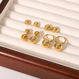 Set of three 18K gold plated stainless steel ball earrings in polished gold finish