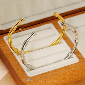 Bamboo style 18K gold and silver plated stainless steel open bangles in a luxury gift box