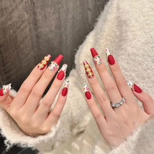 Handmade Chinese wedding press-on nails with red floral art and pearl chain decor