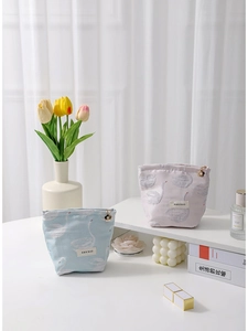 Swan jacquard makeup bags in light blue and pink with elegant floral gold zipper pulls