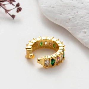 Detailed shot of golden snake-shaped ear cuff with colorful marquise-cut zircons