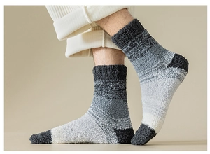 Detailed close-up of thick grey gradient coral fleece sleep socks for winter warmth