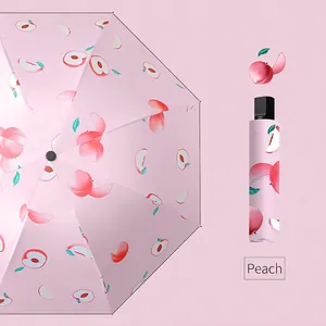 Pink peach pattern folding umbrella with matching capsule storage case for sun and rain