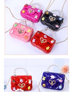 Mini jelly handbag with pearl handle and cartoon patches in various vibrant colors