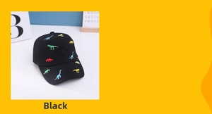 Close-up of black cotton baseball cap with colorful embroidered dinosaur patterns