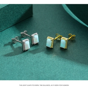 Detailed shot of S925 sterling silver opal earrings with rectangle cut stones and hallmarking