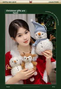 Close-up of soft Christmas snowman and reindeer plush toys with knit hats and cozy scarves