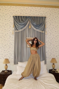 Detail of khaki crop top and high-waist lantern pants two-piece set for women