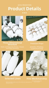 Close-up of premium white linen ring display pillows with detailed texture and structure