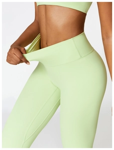 Detail showing the high elasticity and stretch of the mint green yoga pants waist