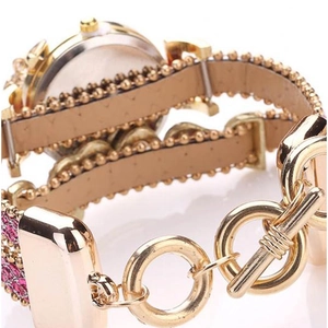 Orologio a bracciale avvolgente dorato con strass viola e chiusura a levetta in metallo