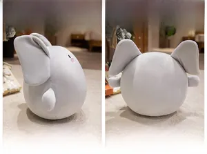 Front and back views of a cute soft grey round elephant plush toy with pink blush