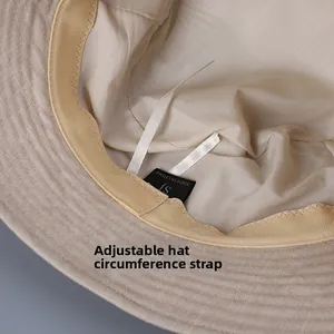Internal detail of a linen sun hat showing adjustable ribbons and sweatband lining