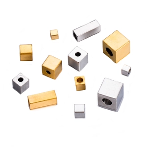 Macro shot of gold and silver square stainless steel spacer beads for DIY jewelry making